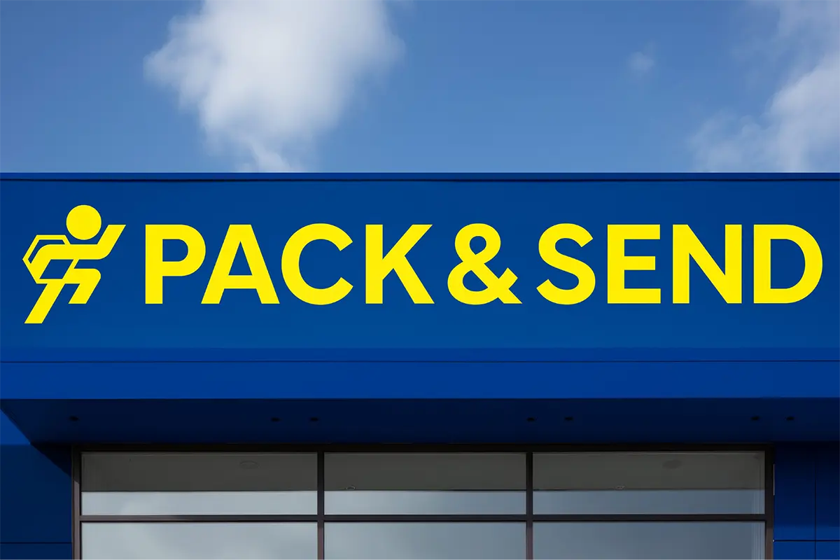 yellow Pack & send writing on blue building 