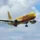 DHL yellow aeroplane flying in the sky
