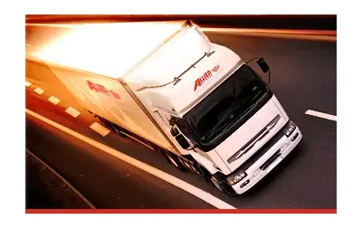 White truck driving on cement road 